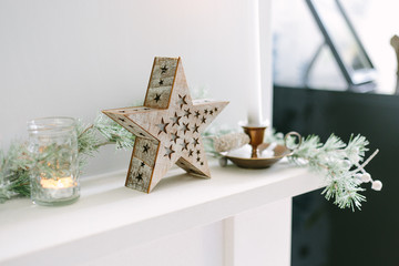 Christmas decor on a stone mantelpiece.