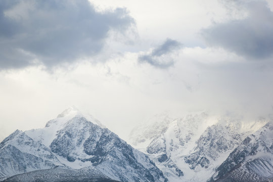 Snowy mountains in mist