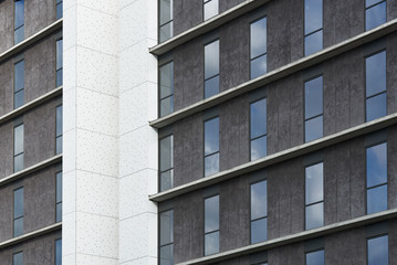 City pattern. Grey and white building facade.