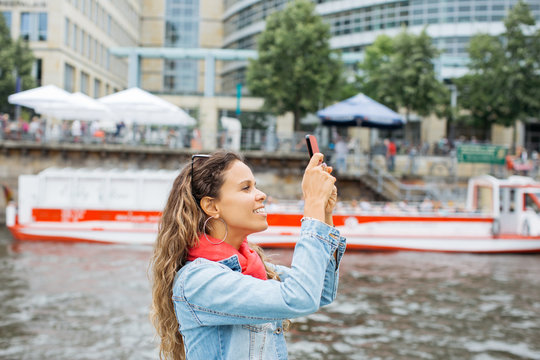 Woman Taking pictures with her Phone