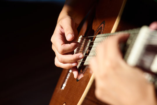 Guitarist playing the melody.