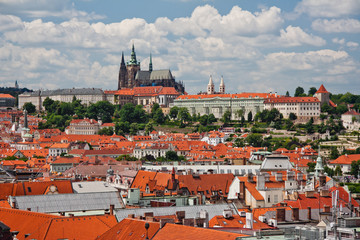 Naklejka na ściany i meble Aerial view of the city. St. Vitus Cathedral over old town red roofs. Prague, Czech Republic