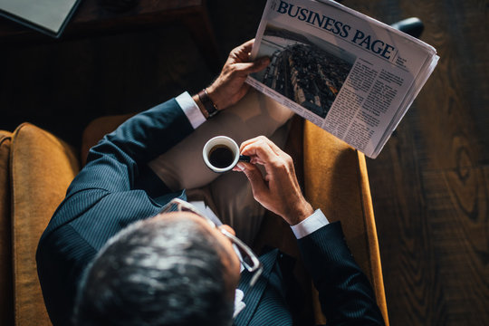 Man Reading Newspaper