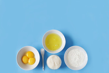 Ingredients for baking - eggs, flour, salt, sugar top view
