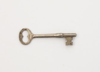 Old skeleton key on white background