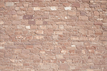 An old wall  built of sandstone blocks is part of an historic building in Southern Utah.