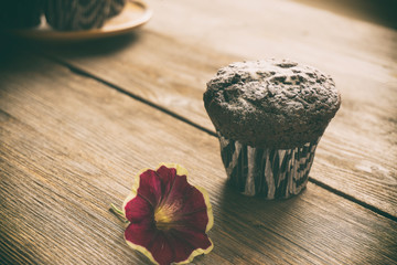 Chocolate cupcake with a flower on the rift table