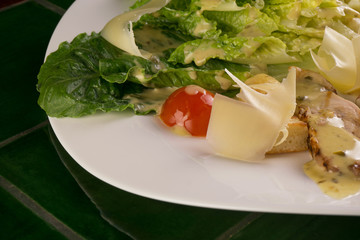Caesar salad on a green background