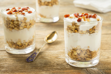 Granola in glasses with yoghurt and pomegranate