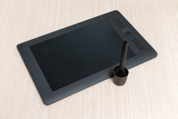 black graphic tablet on the table
