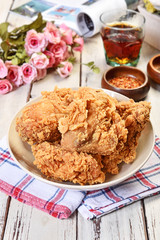 Crispy fried chicken on wooden table