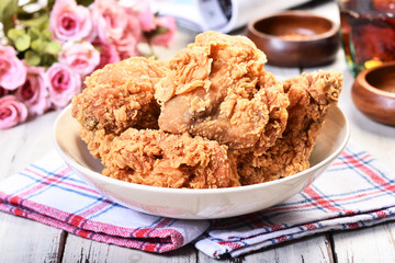 Crispy fried chicken on wooden table