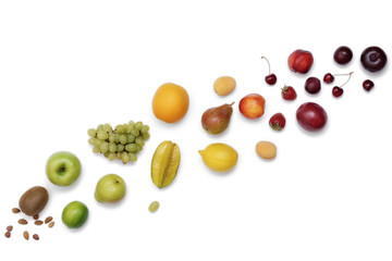 Rainbow colored fruit frame on a white table. Dieting, healthy food concept.