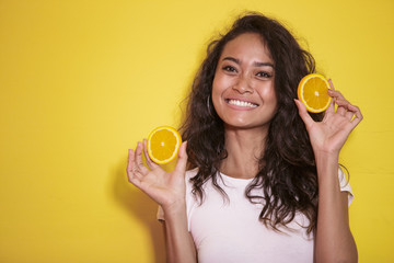 expressive asian woman with slices of fresh lemon