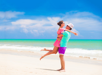 Obraz na płótnie Canvas happy young couple walking and having fun by the beach. Khao Lak, Thailand