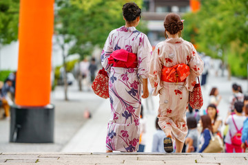 Japanese women walking, rear view