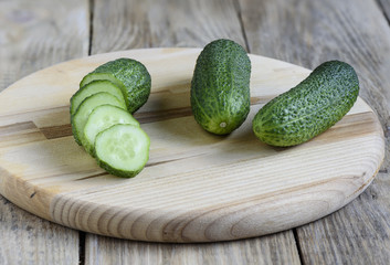 Fresh cucumbers on a cutting board