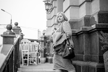 Concept of life modern woman in big city, lifestyle citizen peoples, lady at spring or autumn day. Middle age woman plus size , walk around center streets 