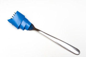 a fork with a strip of wrapped blue ribbon