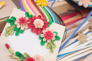 A postcard made by hand.The technique of quilling.