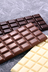 chocolate in diffrent color. milk, dark and white chocolate bars