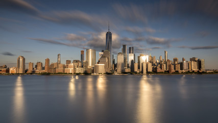 New york city skyline daytime sun clouds blue