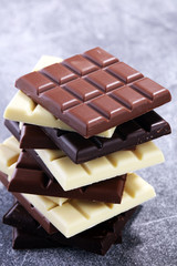 chocolate in diffrent color. milk, dark and white chocolate bars