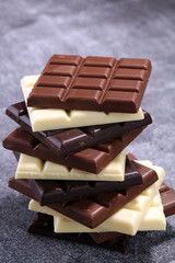 chocolate in diffrent color. milk, dark and white chocolate bars