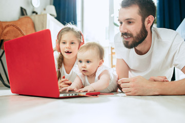 father and his daughters at home