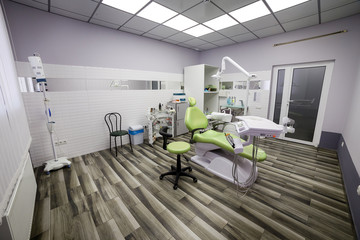 Modern dentistry office interior with chair and tools - medicine, medical equipment and stomatology concept