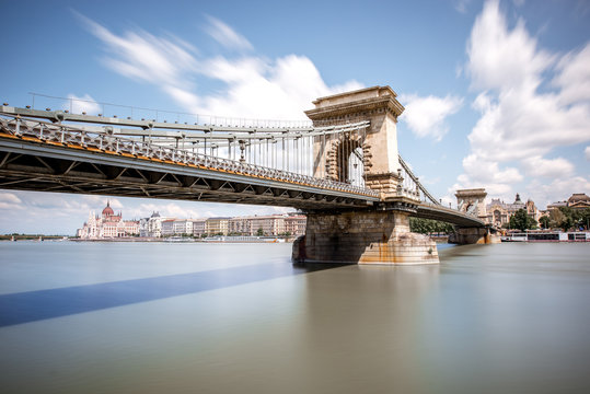 Landscape view on the Chain bridge on Danube river during the daylight in Budapest city, Hungary. Long exposure image technic