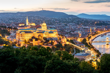 Naklejka premium Aerial landscape view on the illuminated Buda part of Budapest city during the twilight in Budapest, Hungary