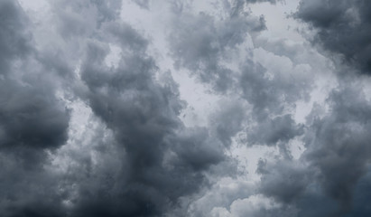 Dark storm clouds before rain used for climate background. Clouds become dark gray before raining. Dramatic background.