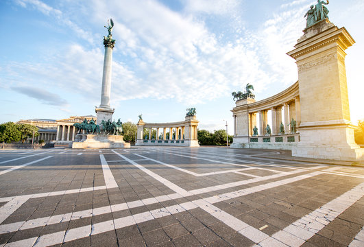 Morning view on the empty Heroes square with monument and column during the sunny weather in Budapest, Hungary