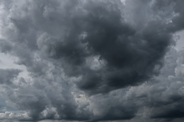 Dark storm clouds before rain used for climate background. Clouds become dark gray before raining. Dramatic background.