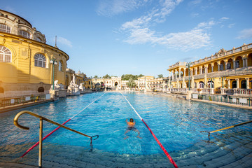 Naklejka premium Szechenyi outdoor thermal baths during the morning light without people in Budapest, Hungary