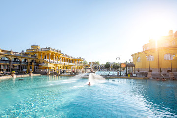 Naklejka premium Szechenyi outdoor thermal baths during the morning light without people in Budapest, Hungary