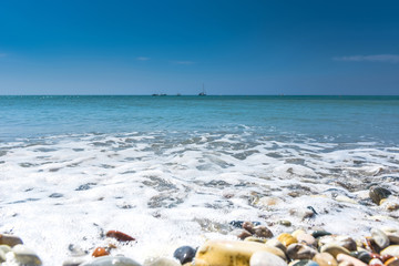 Fototapeta na wymiar Sea, beach and pebble stones