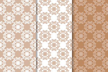 Brown floral backgrounds. Set of seamless patterns