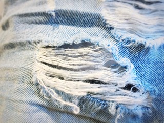 close up of jeans textile pattern with a scratch
