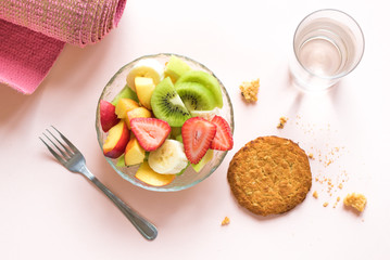 Pink yoga mat and Fruit Salad