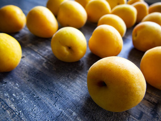 ripe juicy apricots on a wooden table