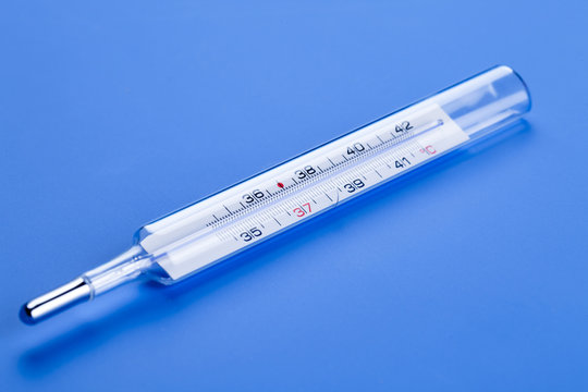 medical thermometer on a blue