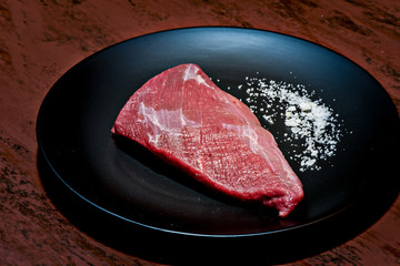 Raw beef fillet with salt
