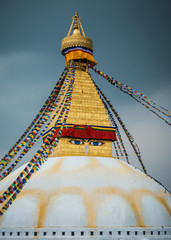 Boudhanath stupa in Kathmandu, Nepal. Stormy clouds in the background. 