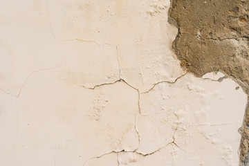 Wall fragment with scratches and cracks