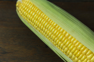 Fresh corn on Table close up image background.
