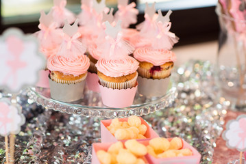 Delicious pink cupcakes on candybar