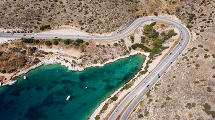 Aerial drone bird's eye view photo of Tunnel in Athens riviera seaside road known as hole of Karamanlis, Attica, Greece