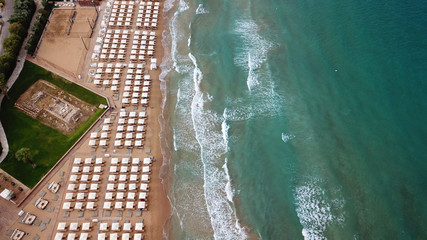 Aerial drone bird's eye photo of famous celebrity wavy sandy beach of Astir or Asteras in south...
